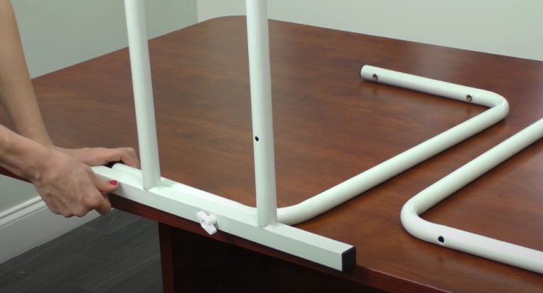 Install Freestanding toilet rails - Attach the arm rest bars to the base bar