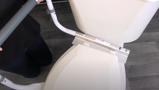 How to Install Toilet Safety Rails - Insert the whole arm into the mounting bracket