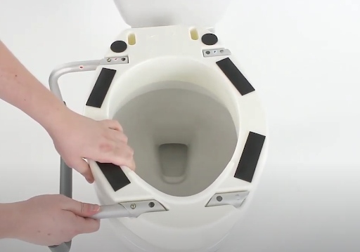 Install Toilet riser with handles - Attach the arm rest