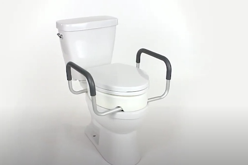 Install Toilet riser with handles - Secure the riser and the lid to the commode
